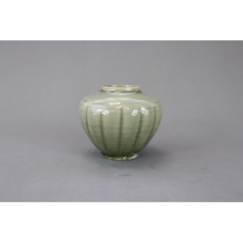 59 - A Rare Yaozhou Celadon Melon-shaped Jar, Song dynasty the lobed globular body thinly potted, rising ... 