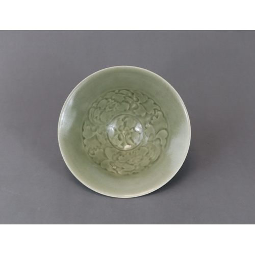 60 - A Moulded Yaozhou Celadon Conical Bowl, Song dynasty with deep flared sides rising to the rounded ri... 