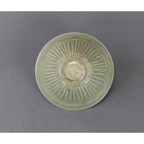 60 - A Moulded Yaozhou Celadon Conical Bowl, Song dynasty with deep flared sides rising to the rounded ri... 