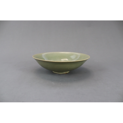 61 - A Yaozhou Celadon Floral Dish, Song dynasty finely potted, with angled sides rising from a broad bas... 