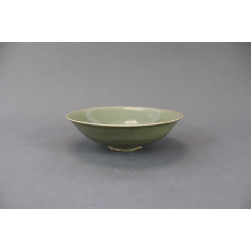 61 - A Yaozhou Celadon Floral Dish, Song dynasty finely potted, with angled sides rising from a broad bas... 