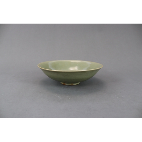 61 - A Yaozhou Celadon Floral Dish, Song dynasty finely potted, with angled sides rising from a broad bas... 