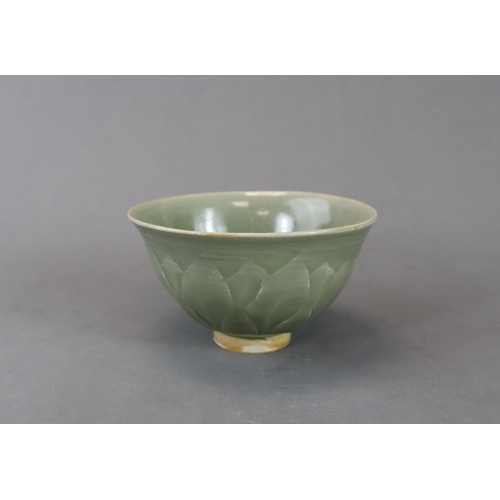 62 - A Carved Yaozhou Celadon Lotus Bowl, Song dynasty the deep gently curved sides rising from a short s... 