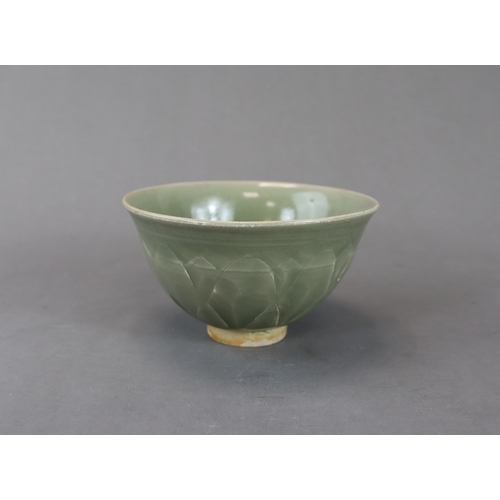 62 - A Carved Yaozhou Celadon Lotus Bowl, Song dynasty the deep gently curved sides rising from a short s... 