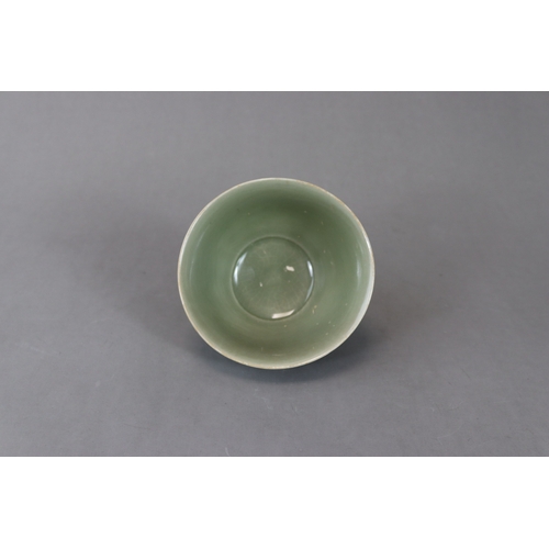 62 - A Carved Yaozhou Celadon Lotus Bowl, Song dynasty the deep gently curved sides rising from a short s... 