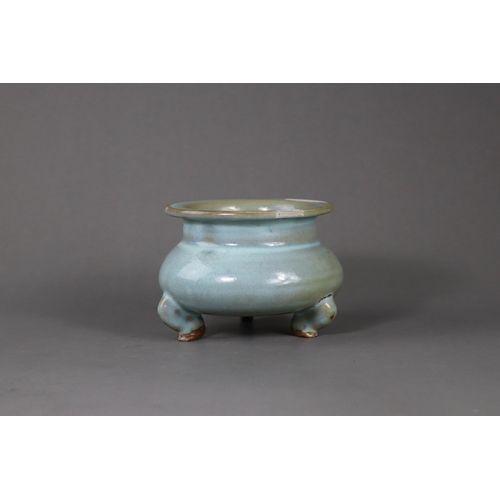 66 - A Rare Jun Blue-glazed Tripod Censer, Song dynasty the compressed globular body supported on three s... 