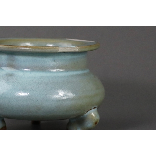 66 - A Rare Jun Blue-glazed Tripod Censer, Song dynasty the compressed globular body supported on three s... 