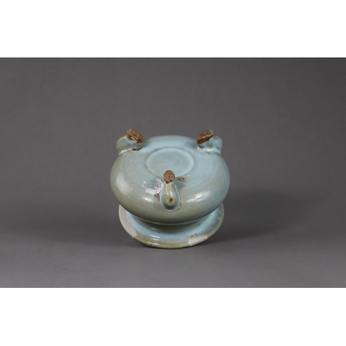 66 - A Rare Jun Blue-glazed Tripod Censer, Song dynasty the compressed globular body supported on three s... 