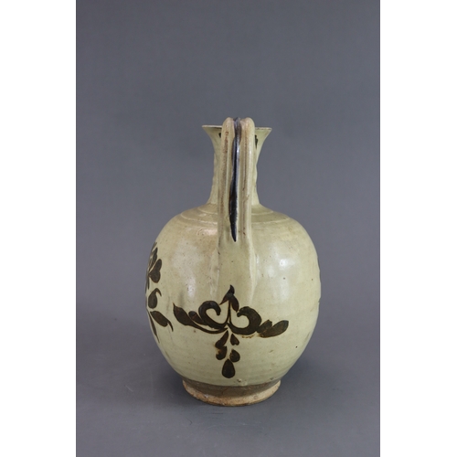 69 - A Cizhou Painted Floral Ewer, Song dynasty rounded body from short straight foot continued with wais... 