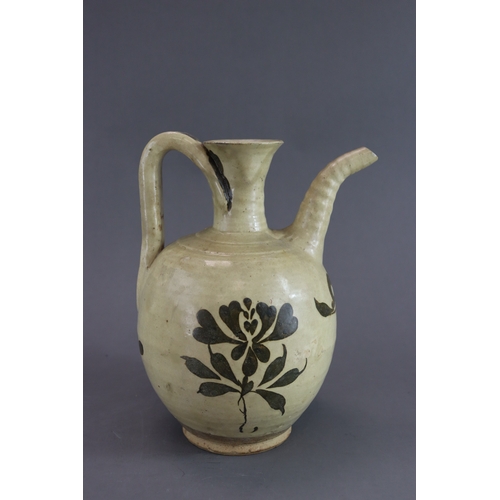 69 - A Cizhou Painted Floral Ewer, Song dynasty rounded body from short straight foot continued with wais... 