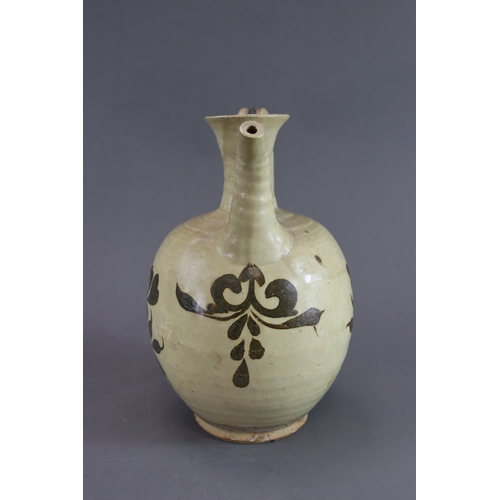 69 - A Cizhou Painted Floral Ewer, Song dynasty rounded body from short straight foot continued with wais... 