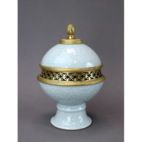 70 - A Celadon Stembowl and Cover carved with Lotus, six character mark of Qianlong the rounded exterior ... 