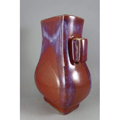 71 - A Flambe Arrow Vase, 18/19th century,  of pear shape and rectangular section, strikingly glazed with... 