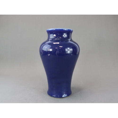 73 - An Elegant Blue Glazed Vase, 18th century, of tall baluster form, with waisted wide neck rising to a... 