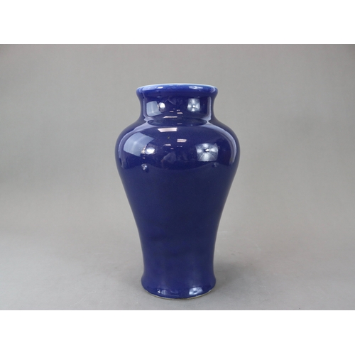 73 - An Elegant Blue Glazed Vase, 18th century, of tall baluster form, with waisted wide neck rising to a... 