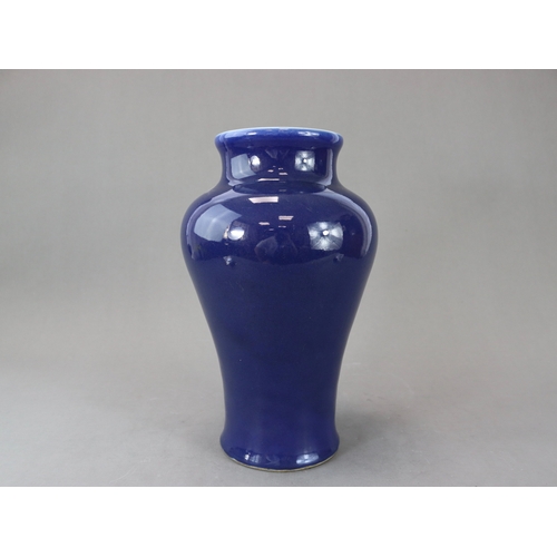 73 - An Elegant Blue Glazed Vase, 18th century, of tall baluster form, with waisted wide neck rising to a... 