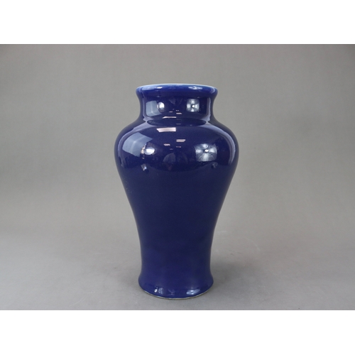 73 - An Elegant Blue Glazed Vase, 18th century, of tall baluster form, with waisted wide neck rising to a... 