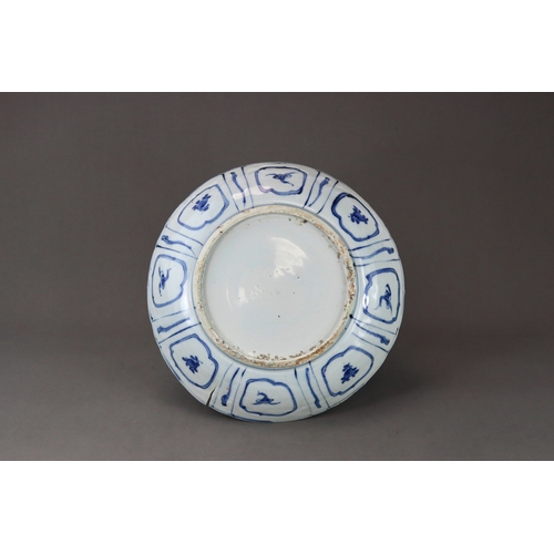 79 - A Blue and White Saucer Dish, Chongzhen,  well painted in strong blue with a barbed central medallio... 