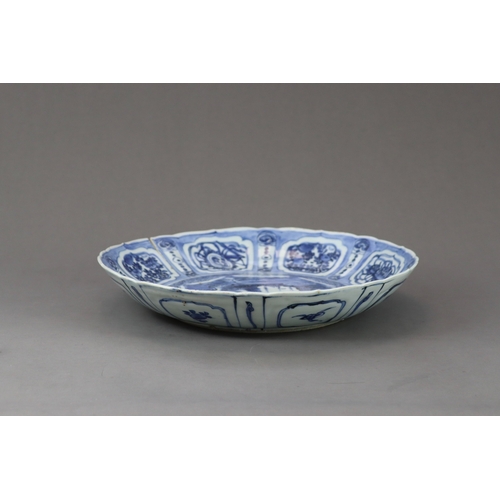 79 - A Blue and White Saucer Dish, Chongzhen,  well painted in strong blue with a barbed central medallio... 