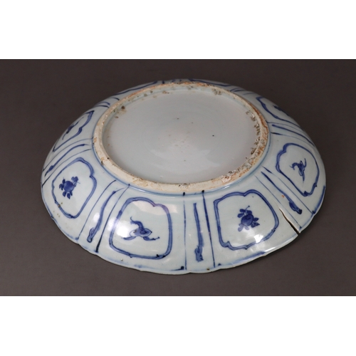 79 - A Blue and White Saucer Dish, Chongzhen,  well painted in strong blue with a barbed central medallio... 