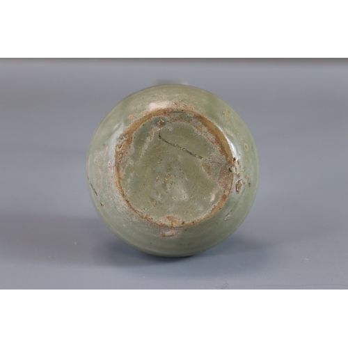 8 - A Yue Celadon Waterpot, Tang dynasty rounded sides from flat base to incurved rim, overall in transl... 