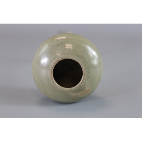 8 - A Yue Celadon Waterpot, Tang dynasty rounded sides from flat base to incurved rim, overall in transl... 