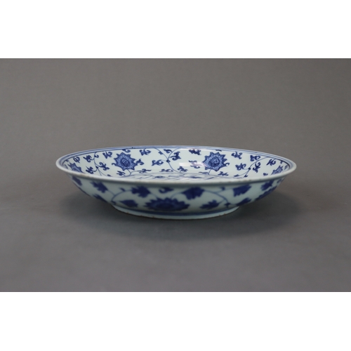 83 - A Blue and White Dish with Lotus, six character mark of Jiajing and of the period, well painted in s... 