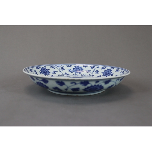 83 - A Blue and White Dish with Lotus, six character mark of Jiajing and of the period, well painted in s... 