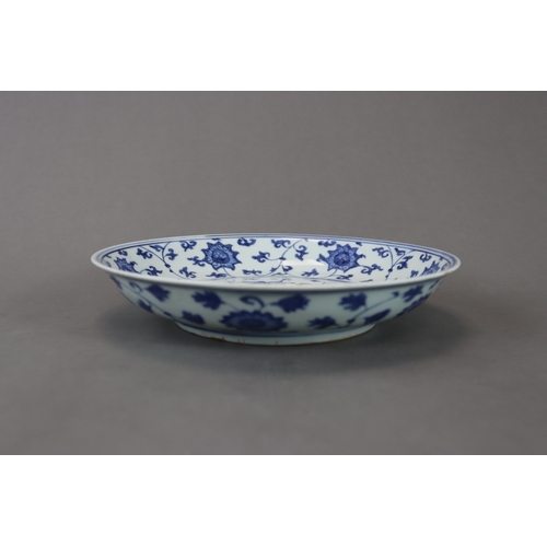 83 - A Blue and White Dish with Lotus, six character mark of Jiajing and of the period, well painted in s... 