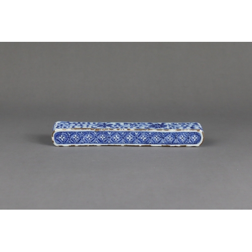 84 - A Rare Blue and White Scrollweight, mid Ming dynasty,  of slender rectangular form with rounded ends... 