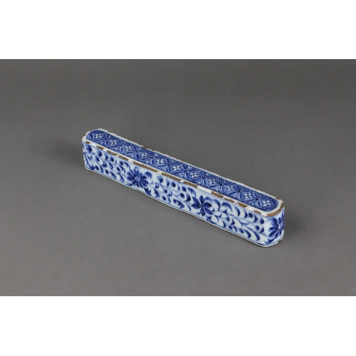 84 - A Rare Blue and White Scrollweight, mid Ming dynasty,  of slender rectangular form with rounded ends... 