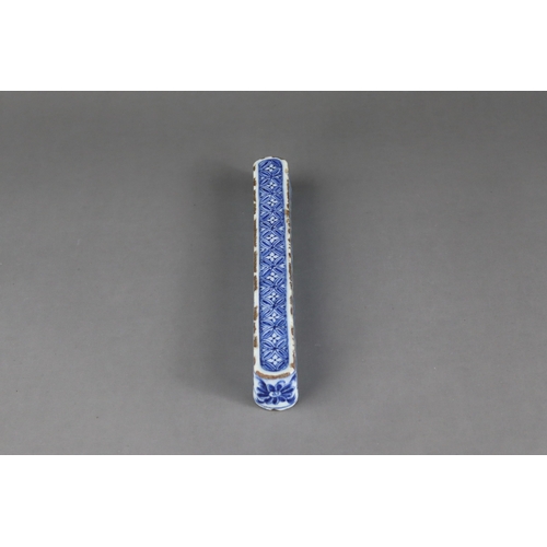 84 - A Rare Blue and White Scrollweight, mid Ming dynasty,  of slender rectangular form with rounded ends... 