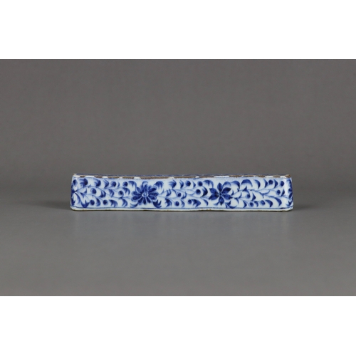 84 - A Rare Blue and White Scrollweight, mid Ming dynasty,  of slender rectangular form with rounded ends... 