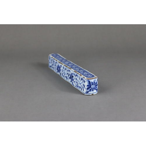 84 - A Rare Blue and White Scrollweight, mid Ming dynasty,  of slender rectangular form with rounded ends... 