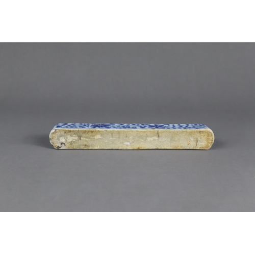 84 - A Rare Blue and White Scrollweight, mid Ming dynasty,  of slender rectangular form with rounded ends... 