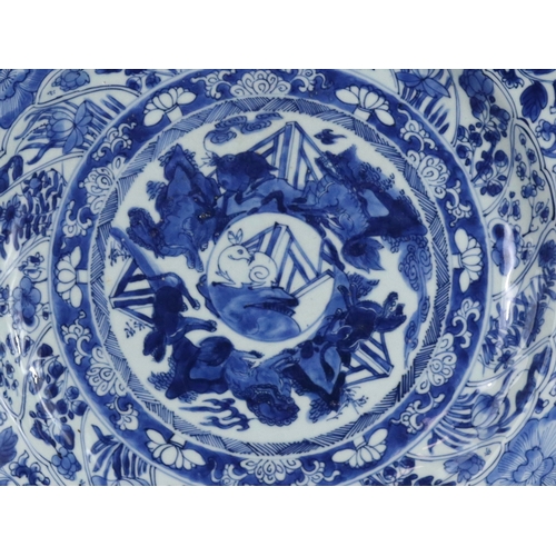 87 - A Large Blue and White 'Moon Rabbit' Dish, Kangxi, with central rabbit medallion within a ring of da... 