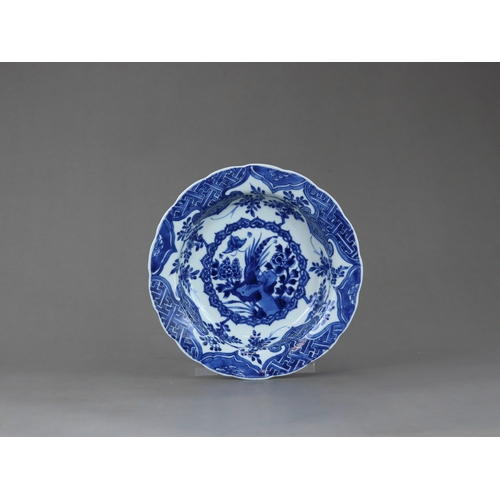 88 - A Blue and White Pheasant Dish, Kangxi,  of small basin form, painted in intense cobalt with a centr... 