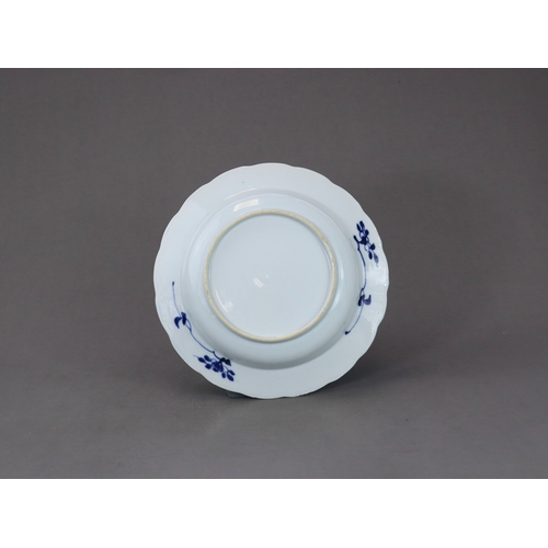 88 - A Blue and White Pheasant Dish, Kangxi,  of small basin form, painted in intense cobalt with a centr... 