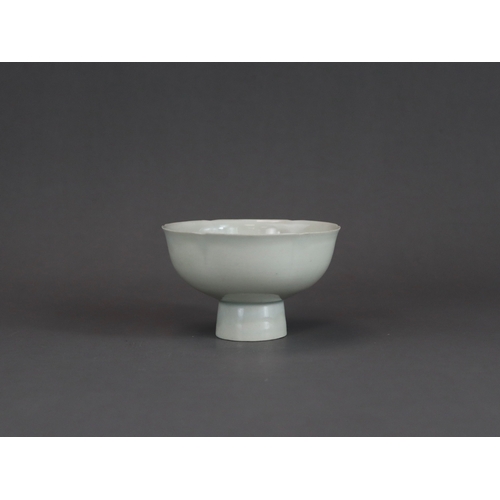 9 - A Qingbai Lobed Cup, Song dynasty with rounded sides rising from a tall splayed foot and flaring to ... 