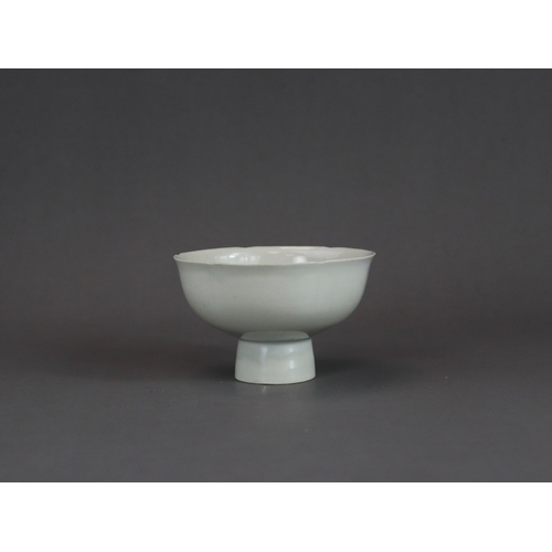 9 - A Qingbai Lobed Cup, Song dynasty with rounded sides rising from a tall splayed foot and flaring to ... 