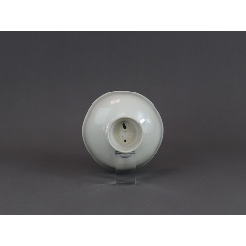 9 - A Qingbai Lobed Cup, Song dynasty with rounded sides rising from a tall splayed foot and flaring to ... 