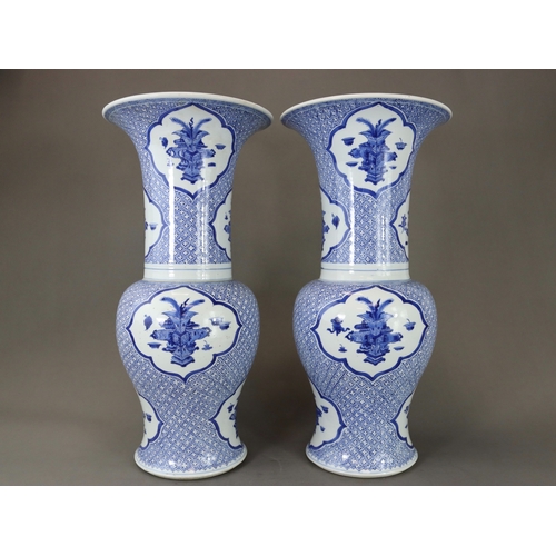 93 - An Attractive Pair of Blue and White 'Phoenix Tail' Vases, Kangxi,  each decorated in rich blue with... 