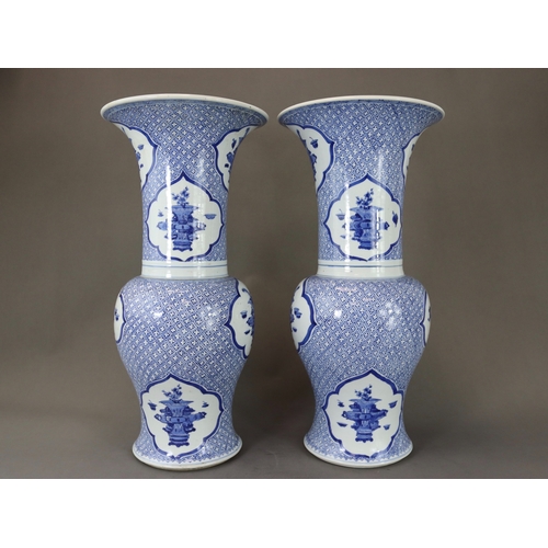 93 - An Attractive Pair of Blue and White 'Phoenix Tail' Vases, Kangxi,  each decorated in rich blue with... 