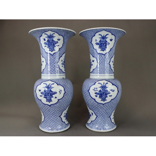 93 - An Attractive Pair of Blue and White 'Phoenix Tail' Vases, Kangxi,  each decorated in rich blue with... 