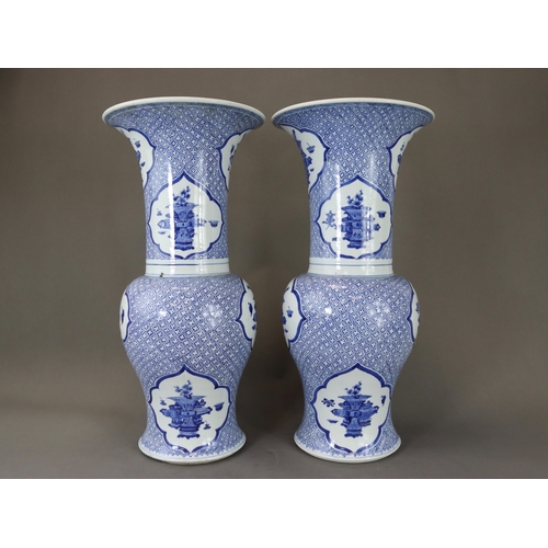 93 - An Attractive Pair of Blue and White 'Phoenix Tail' Vases, Kangxi,  each decorated in rich blue with... 