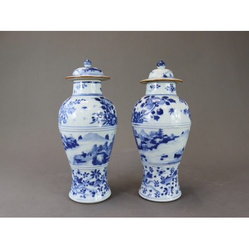 95 - A Pair of Blue and White Vases and Covers, Kangxi of slender baluster form, well painted around the ... 