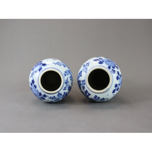 95 - A Pair of Blue and White Vases and Covers, Kangxi of slender baluster form, well painted around the ... 