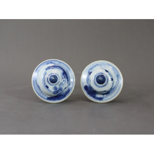 95 - A Pair of Blue and White Vases and Covers, Kangxi of slender baluster form, well painted around the ... 