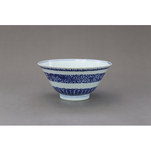 98 - A Blue and White Bowl,c.1730, The flared sides decorated in inky tones on the exterior with a centra... 