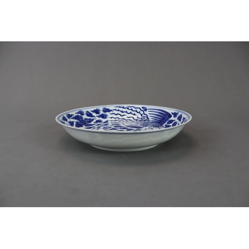 99 - A Blue and White Phoenix Dish, Guangxu mark and of the period painted in soft deep tones on the inte... 